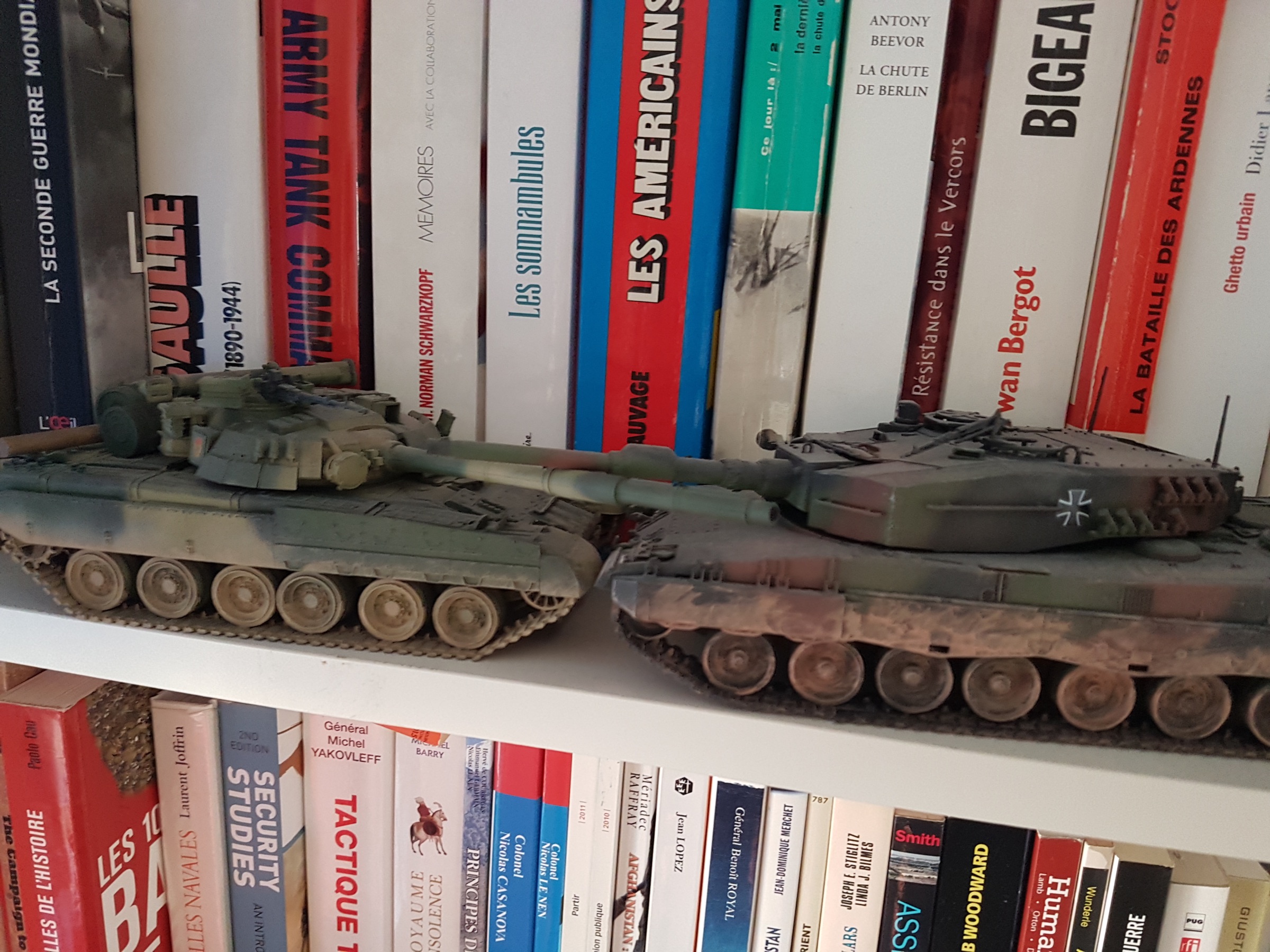 T-80UD and Leopard 2A4 scale models on shelves